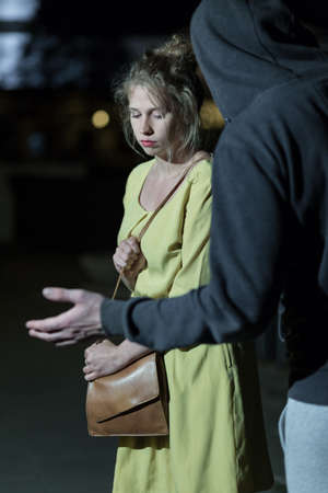 Strange man is very dangerous for young womanの写真素材