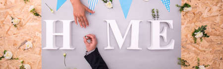 Young and elegant couple is making new homeの写真素材