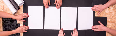 Group of people is holding pieces of paperの写真素材