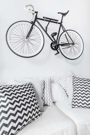 Bike suspended on the wall in modern interiorの写真素材