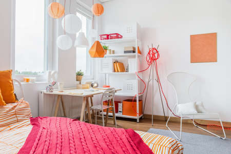 Red and orange decoration in teen roomの写真素材