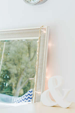 Vertical picture of big decorative mirror in roomの写真素材