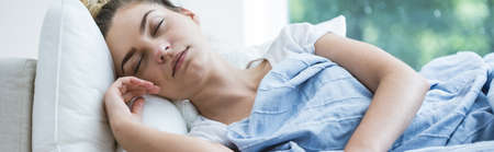 Young woman is very tired during illness