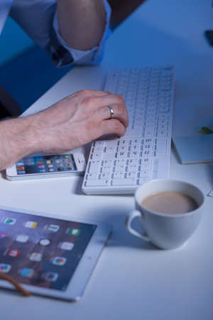 Close-up of coffee with milk on the working man's desk