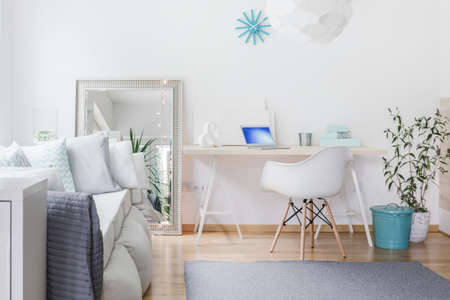 Bright nook with desk in living roomの写真素材