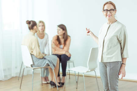 Coach giving seminar for modern active womanの写真素材