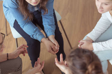 Close-up of young women brainstorming during meetingの写真素材