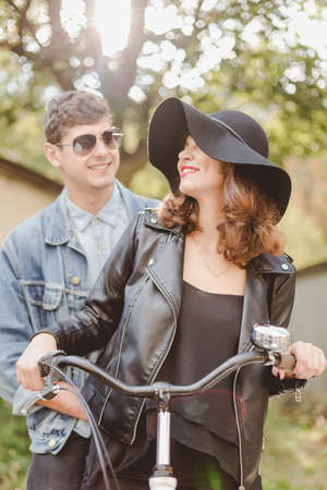 Happy couple riding on the bike togetherの写真素材