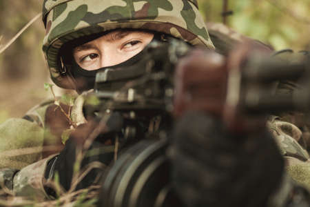 Close-up of female soldier in the battlefieldの写真素材