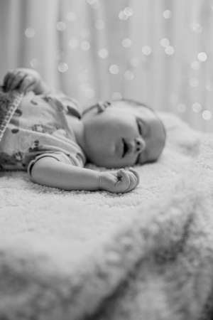 Picture of cute baby resting with mouth openの写真素材