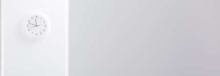 Panorama of simple white clock in corporation officeの写真素材