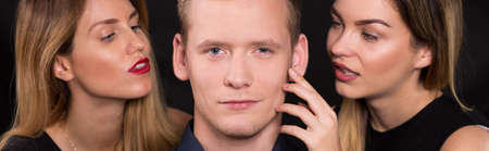 Erotic triangle of two woman and one manの写真素材