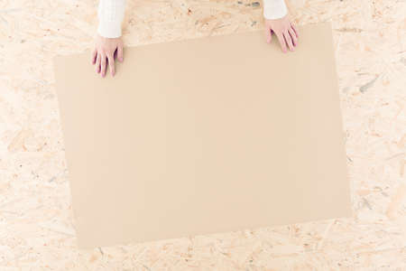 Photo of person preparing xmas handmade paper decorationの写真素材