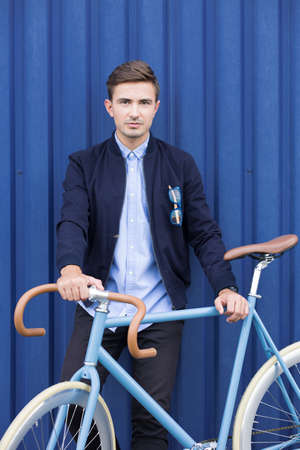 Young ecological businessman caring about the environmentの写真素材