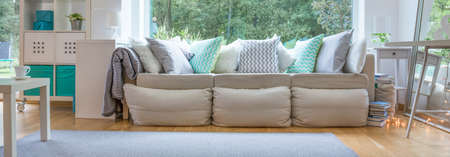 Panorama of sophisticated room with comfortable relaxing areaの写真素材