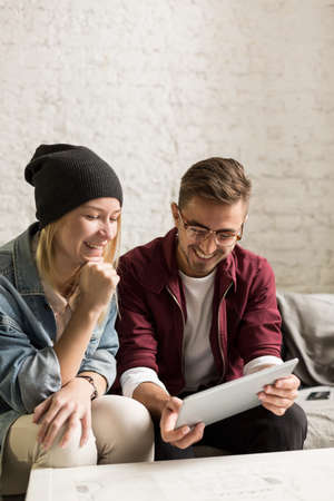 Young happy couple of friends spending time together