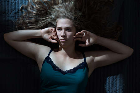 Image of pensive lady during sleepless night