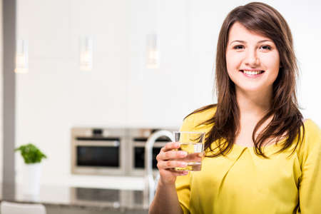Young beauty woman with glass of water Young beauty woman with glass of water