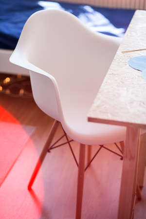 White chair and wooden desk in study roomの写真素材