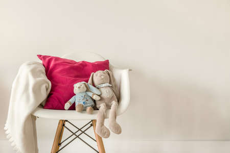 Picture of infant accessories on white modern chairの写真素材