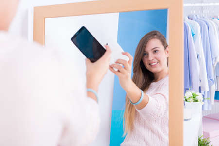 Picture of happy woman with diabetes taking selfieの写真素材