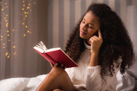 African American woman with her favorite book