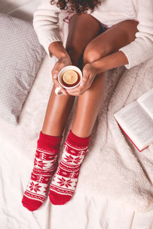 Drinking tea with lemon during winter day