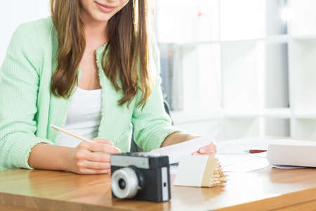 Picture of female office worker sitting at deskの写真素材