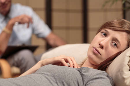 Close up of a woman druring psychotherapy sessionの写真素材