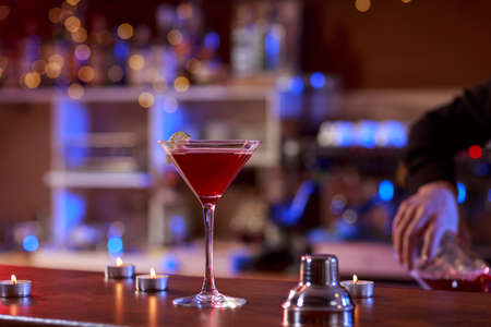 Glass with red martini on the barの写真素材