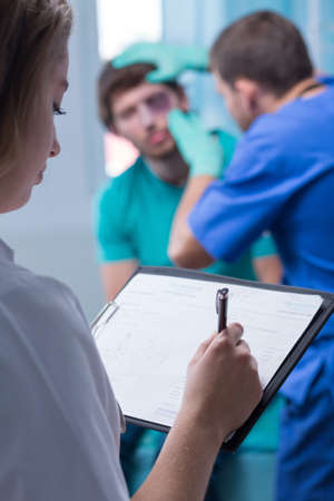 Picture of patient doctor and nurse in emergency room