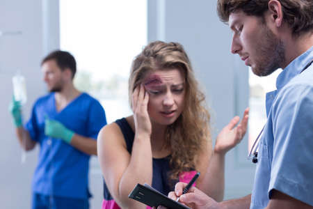 Photo of female patient and doctor in emergency room