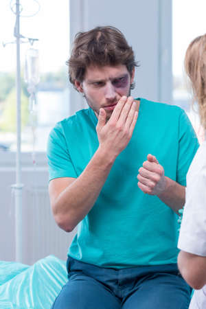 Image of man with pain in surgery room