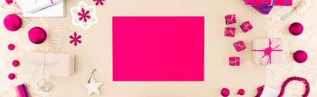 Pink papers for packing christmas gifts at homeの写真素材