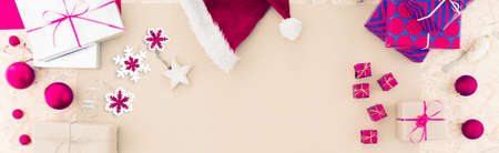 Beautiful packed christmas presents on tableの写真素材