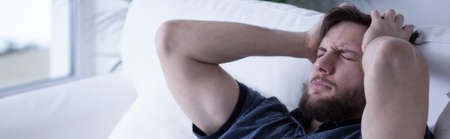 Panoramic view of man having a headacheの写真素材