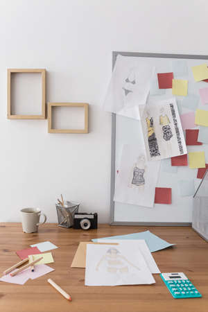 Fashion designer's desk with sketch projects on it