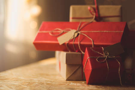 Gifts wrapped in red and brown ecological paperの写真素材