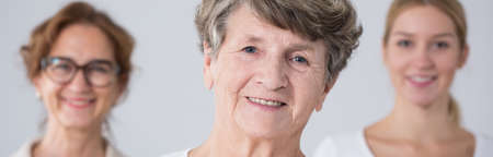 Portrait of happy grandmother and her familyの写真素材