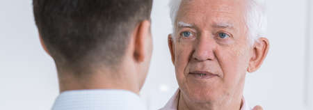 Close relations between father and adult sonの写真素材