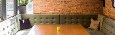 Comfortable big couch in modern loft restaurant