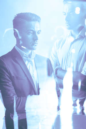 Multiple exposure of casual and elegant businessman
