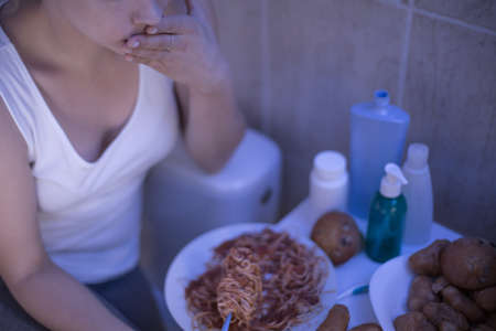 Lonely teenage girl has dangerous eating disorderの写真素材