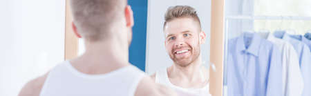 Panorama of metrosexual man preparing to meetingの写真素材