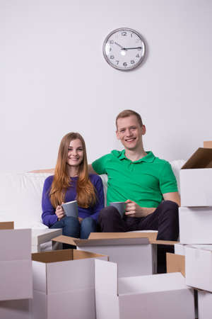 Image of young married couple changing place of residence