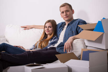 Photo of married couple moving in their new homeの写真素材