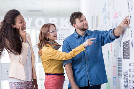 Young employees are talking with their bossの写真素材