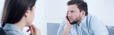 Sad young depressed man with no power to liveの写真素材