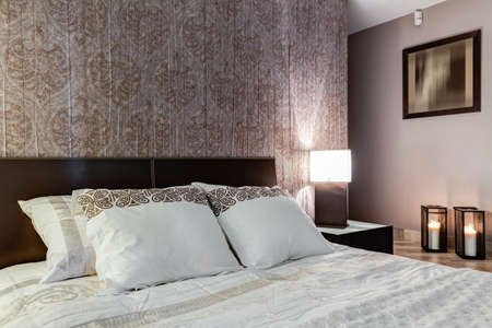 Posh master bedroom with expensive elegant walpaper