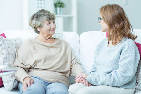 Women sitting on the sofa and talking